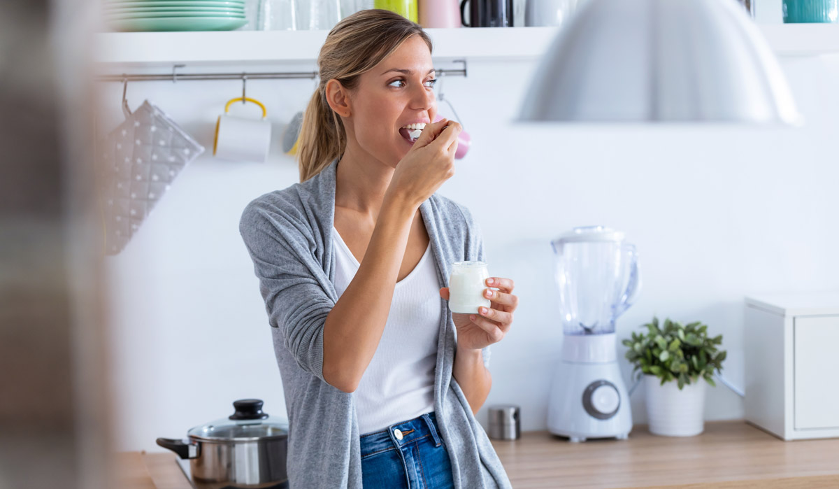 woman eating yogurt